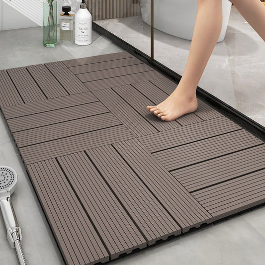 Wooden floor tiles on a bathroom floor with a person stepping onto them.
