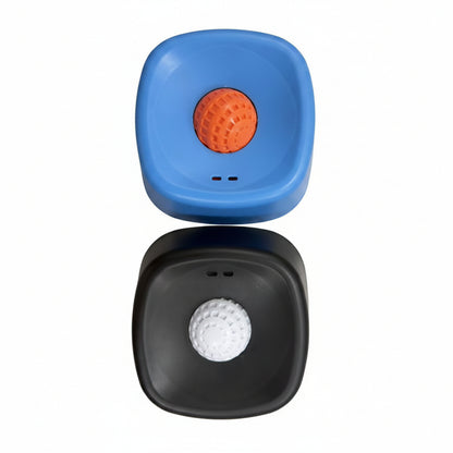 Blue and black pet toy container with an orange ball and white ball on a white surface